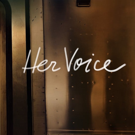 Le titre "Her Voice" est écrit en blanc.